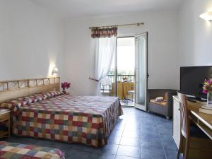 Postel nebo postele na pokoji v ubytování Hotel I Melograni