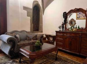 a living room with a couch and a table at Burg Hermannstein - Queens Room in Wetzlar