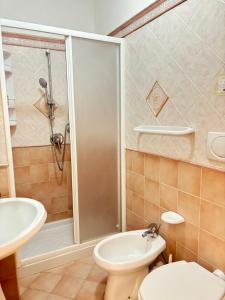 a bathroom with a shower and a toilet and a sink at Casa Josefina in Sant'Angelo D'Ischia