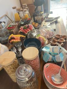 a table with a bunch of food on it at MAR VERDE - Parede-Cascais in Parede