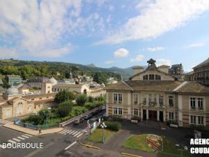 an aerial view of a town with a building at Bel appartement 3*** La Bourboule, 6 pers, Wifi inclus - FR-1-608-250 in La Bourboule