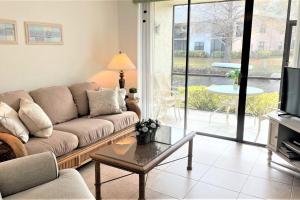 a living room with a couch and a table at Florida Bella Rosa near IMG Academy & beaches in Bradenton