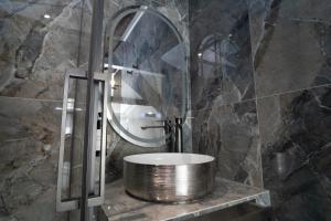 a bathroom with a round sink and a mirror at La Villa Ora in Antibes +51 photos