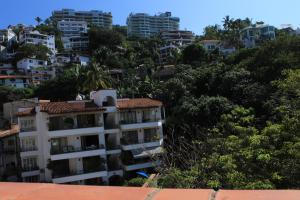 an apartment building in the middle of a city at Zona Romántica Casa Las Magnolias in Puerto Vallarta