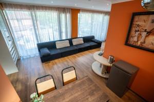 a living room with a couch and a table at Vardisubani Villa in Kazbegi