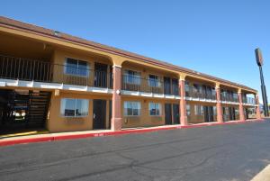 an empty street in front of a building at Super 8 by Wyndham Midwest City OK in Midwest City