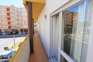 a balcony with a view of a street at Casas do SOL GuestHouse Lagos in Lagos