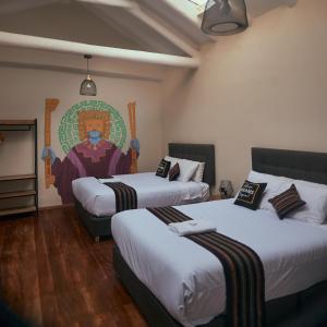 Postel nebo postele na pokoji v ubytování Way Kap Hostel Cusco