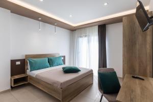 Postel nebo postele na pokoji v ubytování Altum Hotel Tropea