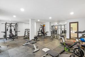 a gym with several treadmills and cardio machines at Bianca 903 Loft at Morgan Residences in Cabo San Lucas