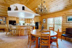 a kitchen and dining room with a table and chairs at Modern Mountain Home in Kings Beach
