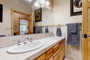 a bathroom with two sinks and a large mirror at Modern Mountain Home in Kings Beach +17 photos