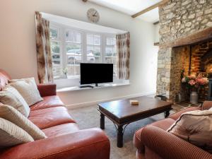 Televiisor ja/või meelelahutuskeskus majutusasutuses Myrtle Cottage