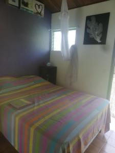 Postel nebo postele na pokoji v ubytování bungalow bord de mer martinique