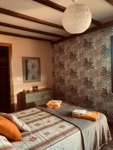a bedroom with a bed and a wall at CASA RURAL LA CIJA in Maello +74 photos