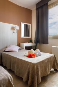 Posteľ alebo postele v izbe v ubytovaní Hotel Alguer