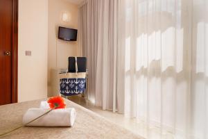 Posteľ alebo postele v izbe v ubytovaní Hotel Alguer