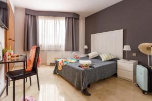 Posteľ alebo postele v izbe v ubytovaní Hotel Alguer