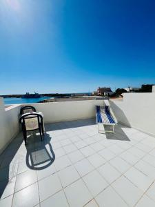 two chairs sitting on top of a roof at Hotel Giglio in Lampedusa