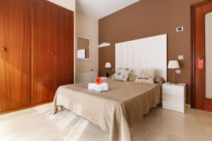 Posteľ alebo postele v izbe v ubytovaní Hotel Alguer