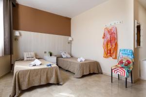 Posteľ alebo postele v izbe v ubytovaní Hotel Alguer