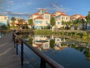 a row of houses next to a body of water at Khách sạn Time Lotus Hạ Long in Ha Long