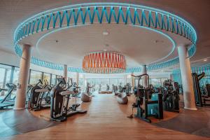 a gym with treadmills and ellipticals in a building at Mara's Apartments Higuerón West - Sunny Terrace - Seaviews in Fuengirola