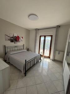 Postel nebo postele na pokoji v ubytování Sunshine Alloggio turistico