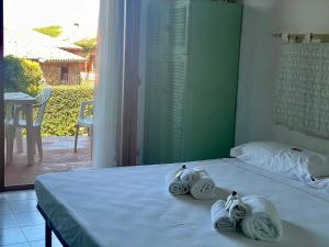 Ένα ή περισσότερα κρεβάτια σε δωμάτιο στο PUNTA EST Monolocale Vista Mare