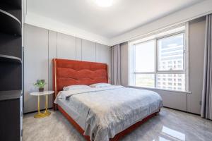 Postel nebo postele na pokoji v ubytování Cloud & Sea Boutique Apartment