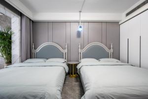 Postel nebo postele na pokoji v ubytování Cloud & Sea Boutique Apartment