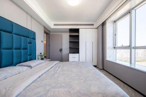 Postel nebo postele na pokoji v ubytování Cloud & Sea Boutique Apartment