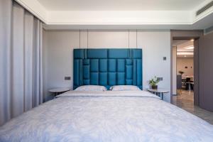 Postel nebo postele na pokoji v ubytování Cloud & Sea Boutique Apartment
