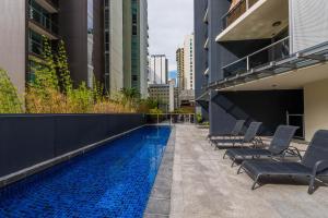 a swimming pool on the side of a building at Mantra on Mary in Brisbane