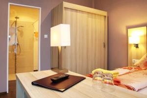 Postel nebo postele na pokoji v ubytování Hotel Rheinkönig