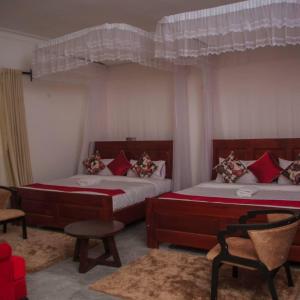 Postel nebo postele na pokoji v ubytování Fortpearls Homestay