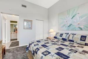 a bedroom with a large bed and a bathroom at St Pete Isla Vista Verde E 3 219 Corner Unit 2 2 in Point Brittany +38 photos