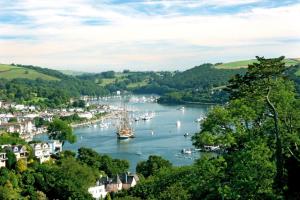 a view of a river with boats in it at Bight Boathouse in Dartmouth