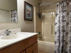 a bathroom with a sink and a shower at Country Roads take me home in Terra Alta +25 photos