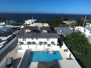 an aerial view of a house with a swimming pool at Sea Breeze Tunnel Hideaway 3 in Quebradillas