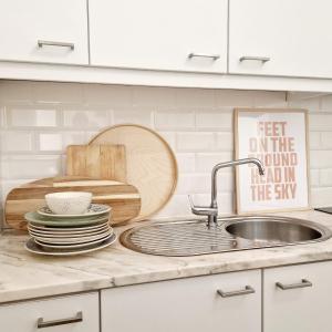 a kitchen counter with a sink and a cutting board at CASAS de CONSTÂNCIA in Constância