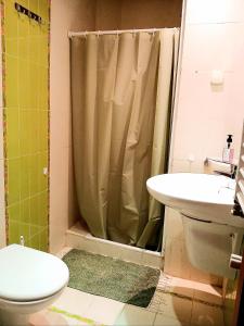 a bathroom with a shower and a toilet and a sink at Studio très haut standing avec vue dégagée in Tunis