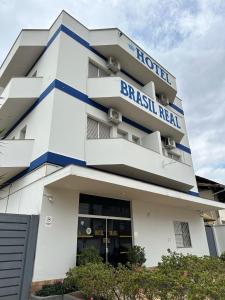 a building with a sign that reads brazil real at Hotel Brasil Real in Mariana