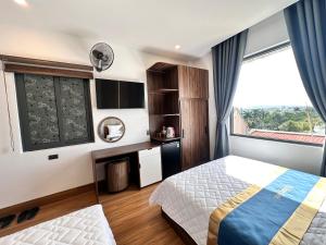 Postel nebo postele na pokoji v ubytování Phi Hùng Hotel
