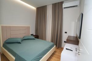Katil atau katil-katil dalam bilik di RS Skendo Apartments