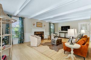 a living room with a couch and a fireplace at Cozy 4bd Home - NC State & Airport nearby in Cary