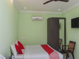 Postel nebo postele na pokoji v ubytování Hotel O Seabreeze Residency