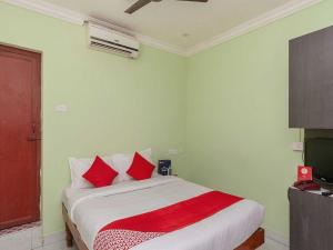 Postel nebo postele na pokoji v ubytování Hotel O Seabreeze Residency
