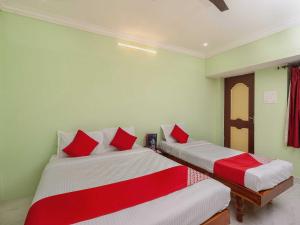 Postel nebo postele na pokoji v ubytování Hotel O Seabreeze Residency