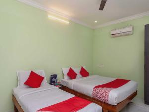 Postel nebo postele na pokoji v ubytování Hotel O Seabreeze Residency